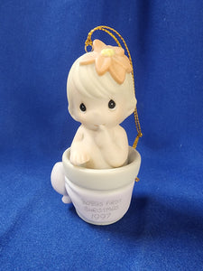 Precious Moments "Baby's First Christmas Ornament - 1997 Girl"