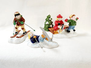 Snow Village "Skaters & Skiers"